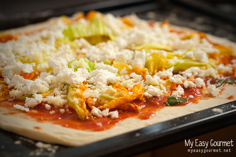 Zucchini flower pizza in the oven