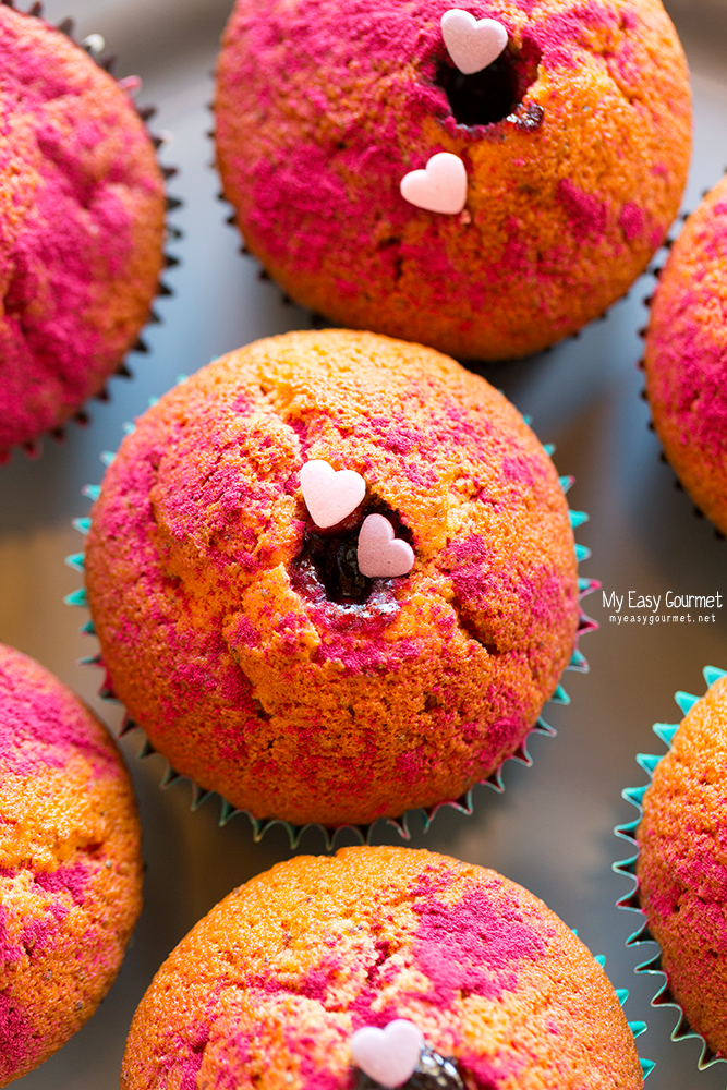 Lemon Poppy Seed Muffins poked with Blueberry jam